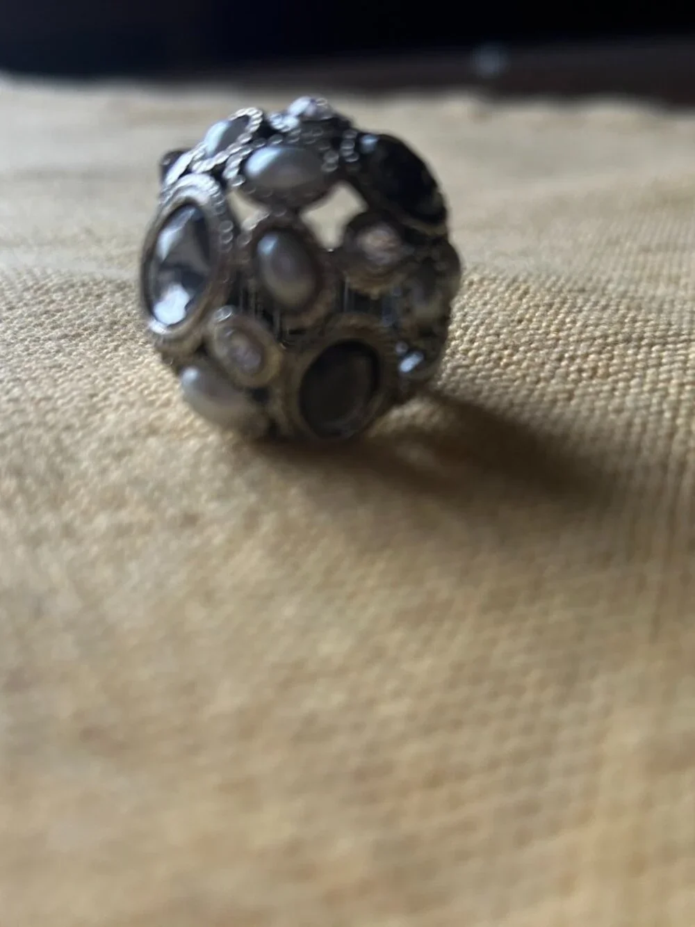 Vintage style sliver-tone dome cocktail ring featuring an intricate cluster of